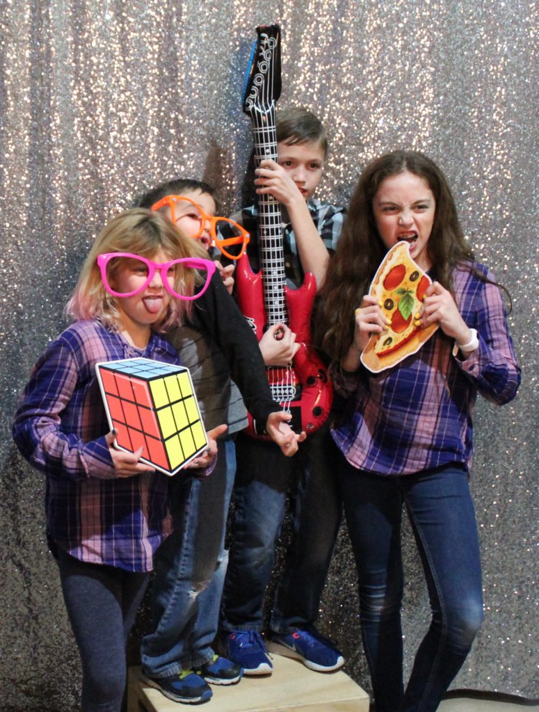 photo of grace kids with children's events - posing with fun props